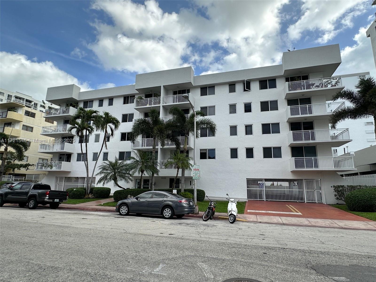 1666 West Avenue, Unit 512 Miami Beach, FL 33139 - Photo 2 of 20 a car parked in front of building