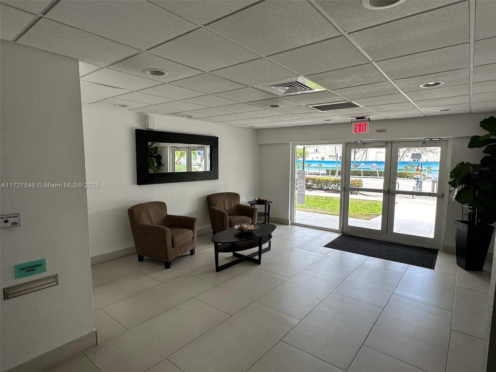 1666 West Avenue, Unit 512 Miami Beach, FL 33139 - Photo 6 of 20 a living room with furniture and large windows