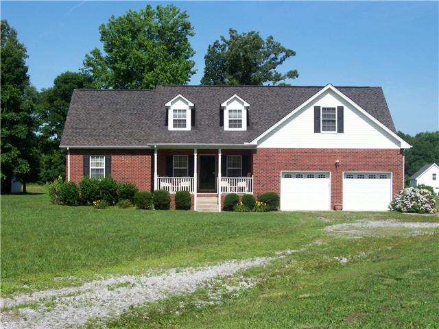1198 Smith Thompson Road Bethpage, TN 37022 - Photo 1 of 20 a front view of a house with a yard and garage