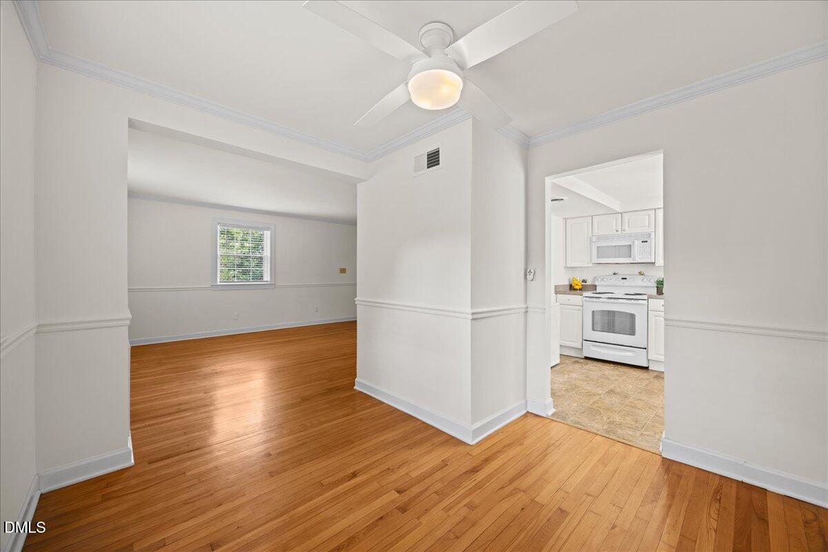 1627 Sutton Drive Raleigh, NC 27605 - Photo 11 of 33 a view of a kitchen with wooden floor and a kitchen space
