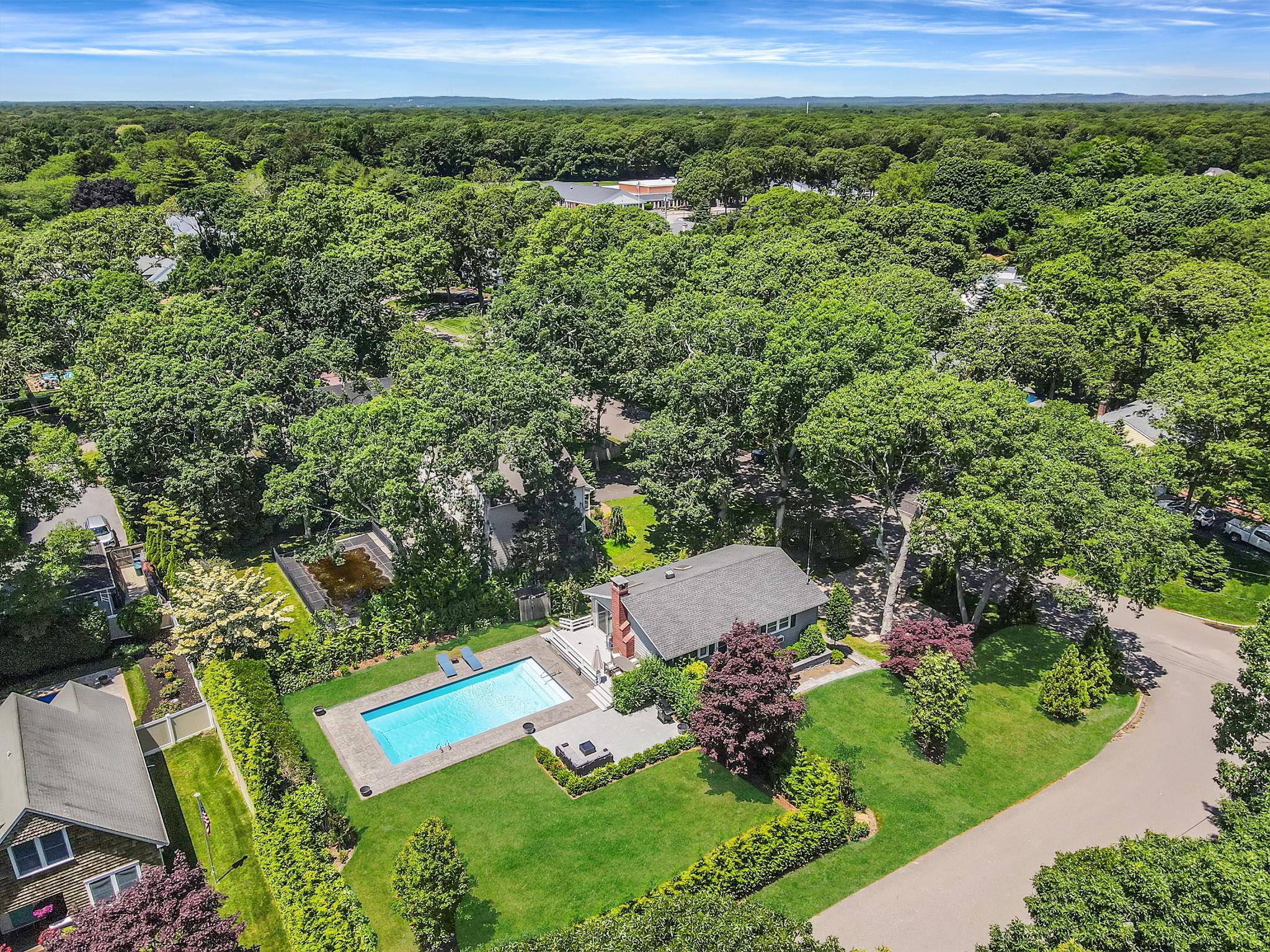 a view of a garden with an outdoor seating
