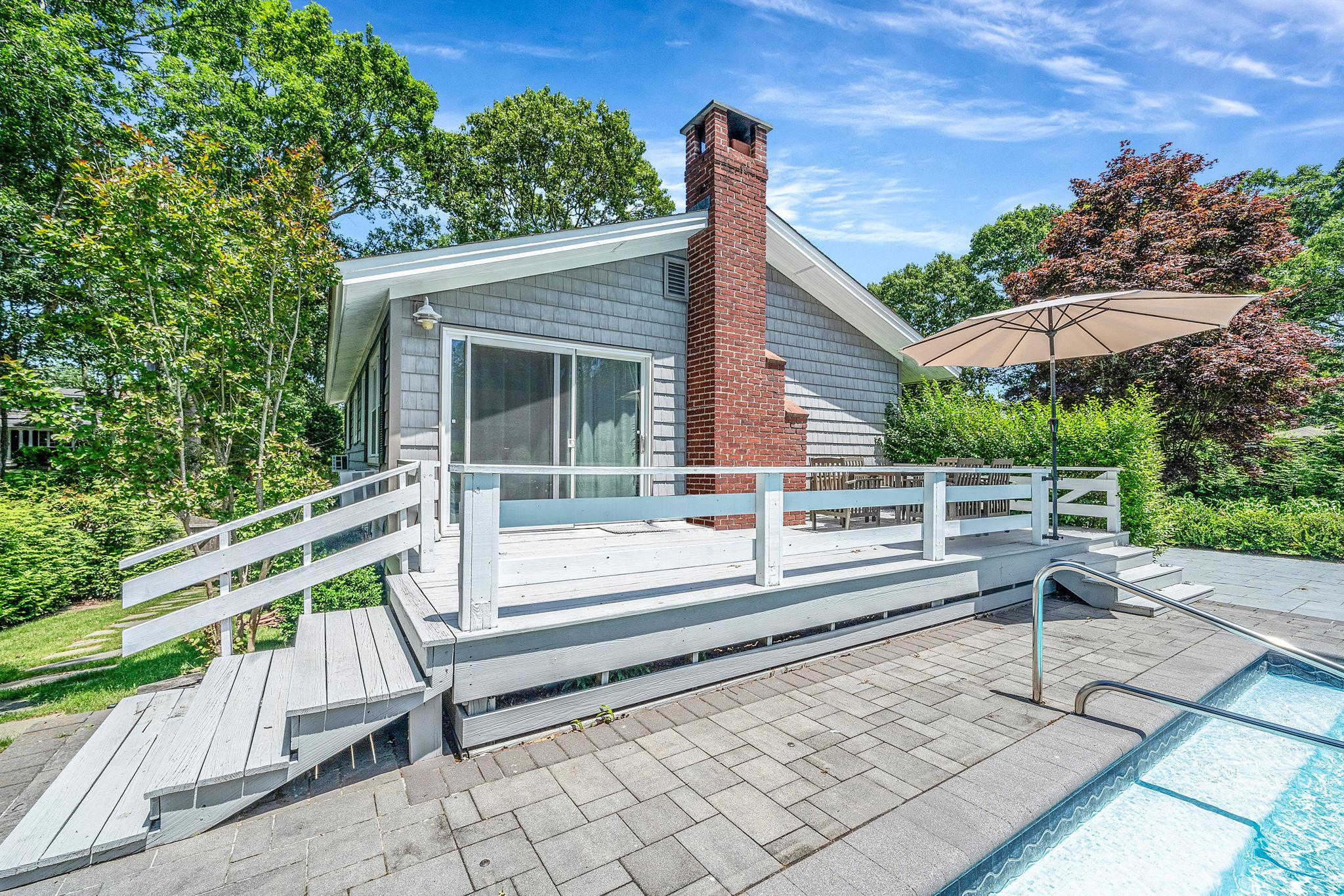 3 Crestview Drive Remsenburg, NY 11960 - Photo 14 of 21 a view of a wooden deck and a yard