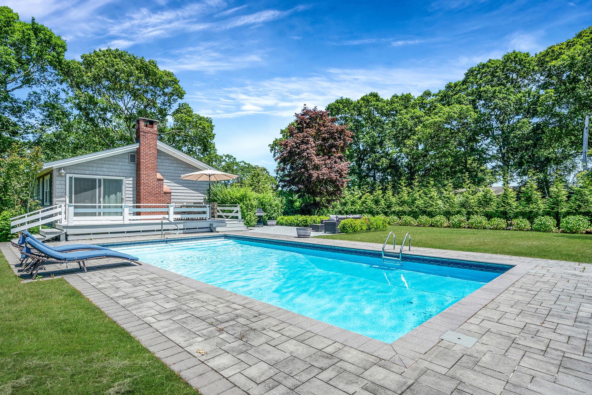 3 Crestview Drive Remsenburg, NY 11960 - Photo 21 of 24 a view of a house with a swimming pool