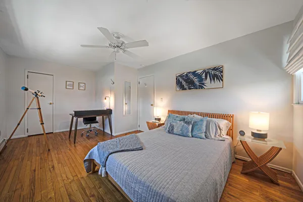 a bedroom with a bed and a table