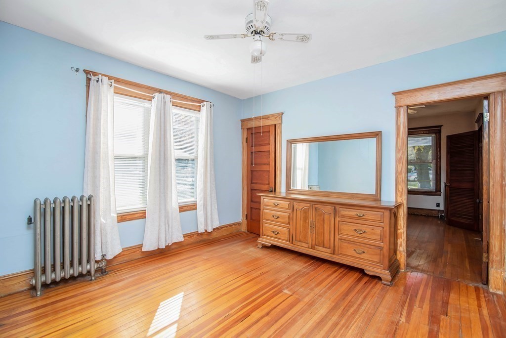 84 Orange Street Springfield, MA 01108 - Photo 11 of 42 a bedroom with furniture and windows