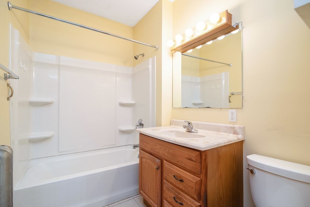 84 Orange Street Springfield, MA 01108 - Photo 17 of 42 a bathroom with a sink toilet vanity and shower