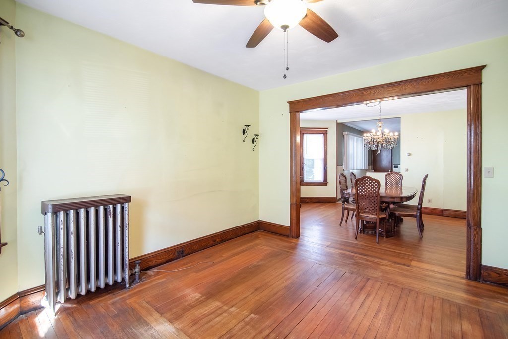 84 Orange Street Springfield, MA 01108 - Photo 3 of 42 a view of a livingroom with furniture and wooden floor