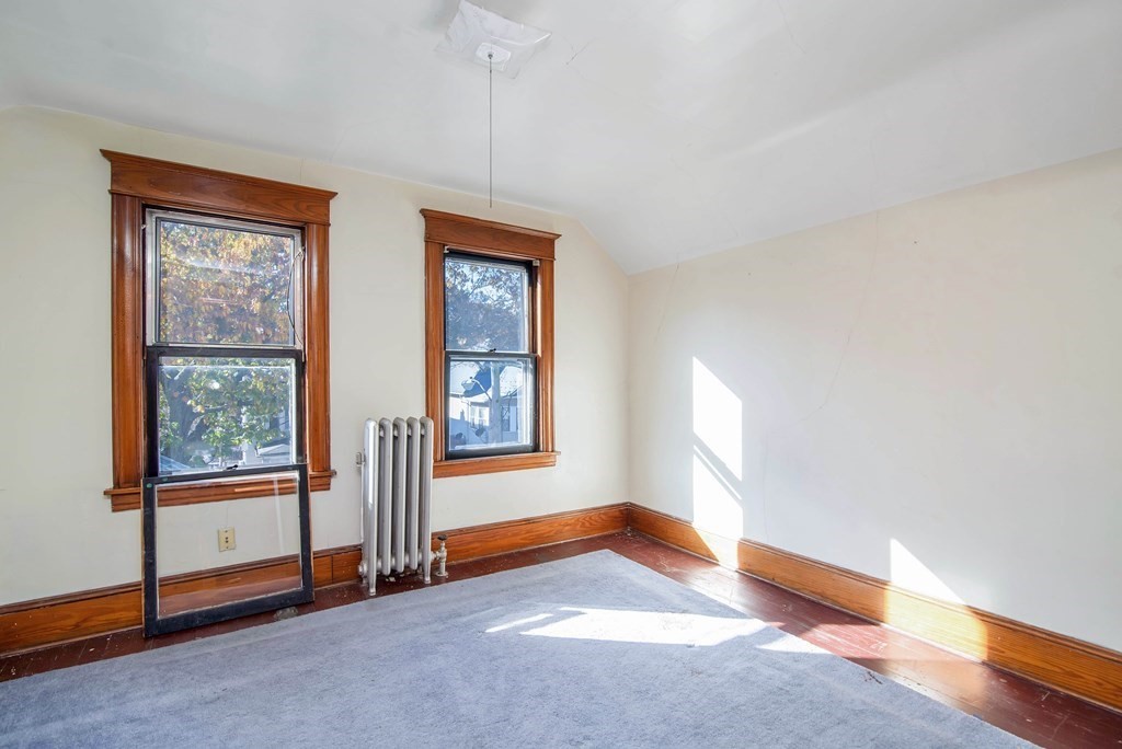 84 Orange Street Springfield, MA 01108 - Photo 34 of 42 a view of an empty room with a window