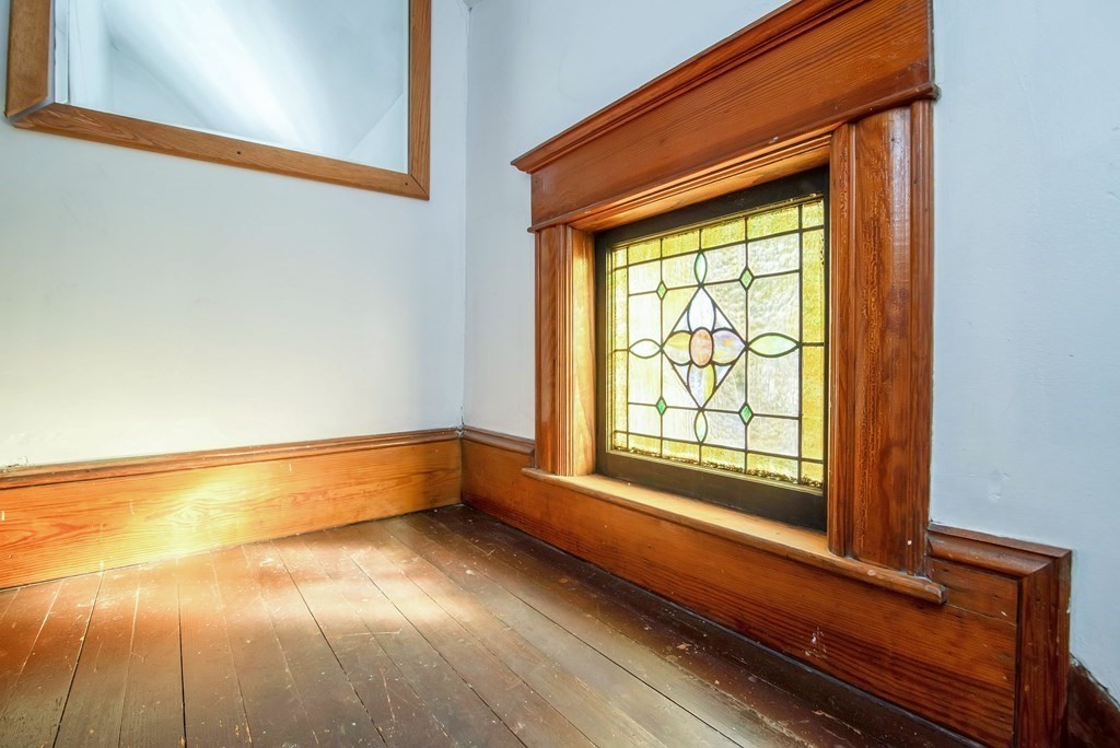 84 Orange Street Springfield, MA 01108 - Photo 35 of 42 a view of room with window and wooden floor