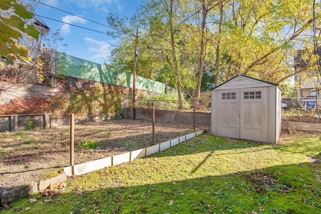 84 Orange Street Springfield, MA 01108 - Photo 38 of 42 a sign board with yard in front of it