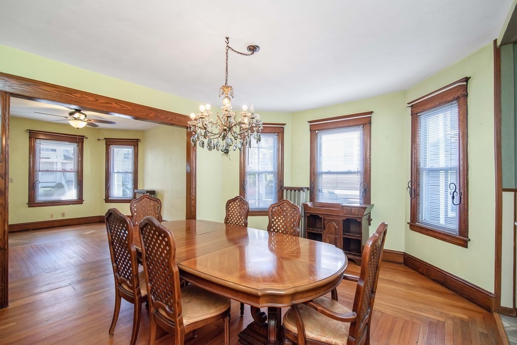 84 Orange Street Springfield, MA 01108 - Photo 5 of 42 a view of a dining room with furniture window and wooden floor
