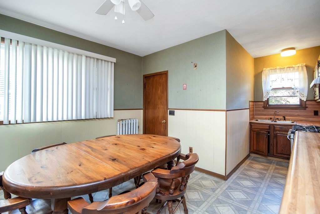 84 Orange Street Springfield, MA 01108 - Photo 9 of 42 a dining room with a table and chairs