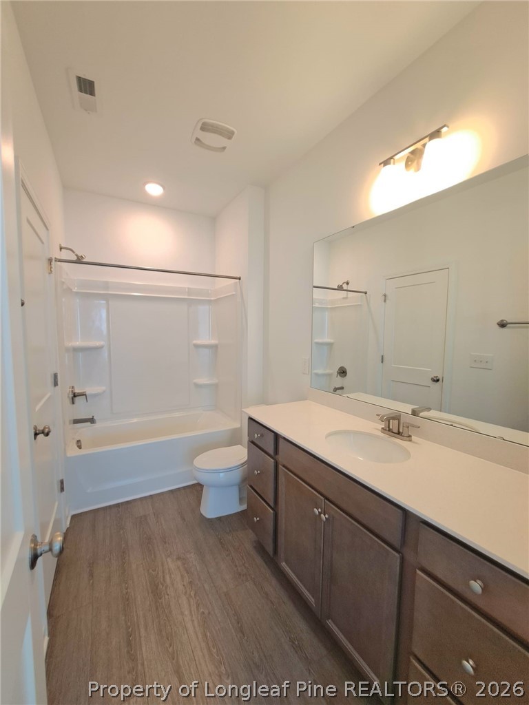 1939 Robin Hill Lane Raleigh, NC 27610 - Photo 18 of 25 a bathroom with a sink a toilet and shower