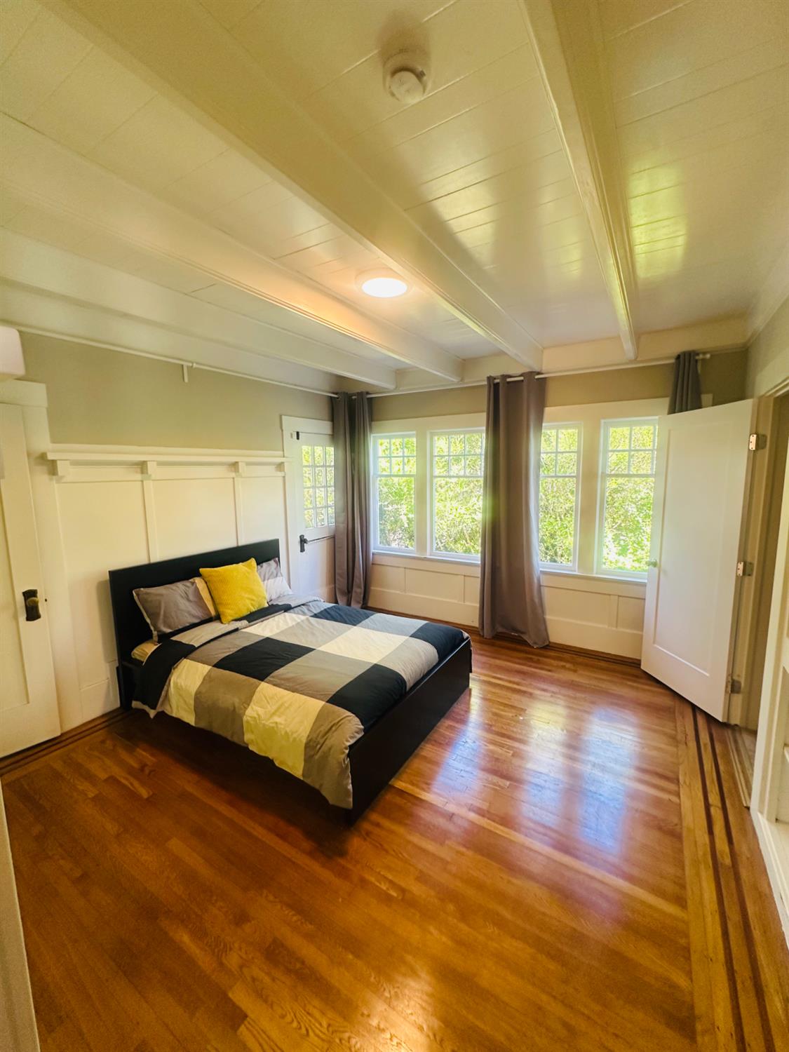 1556 E Street Hayward, CA 94541 - Photo 16 of 65 a bedroom with double bed and wooden floor