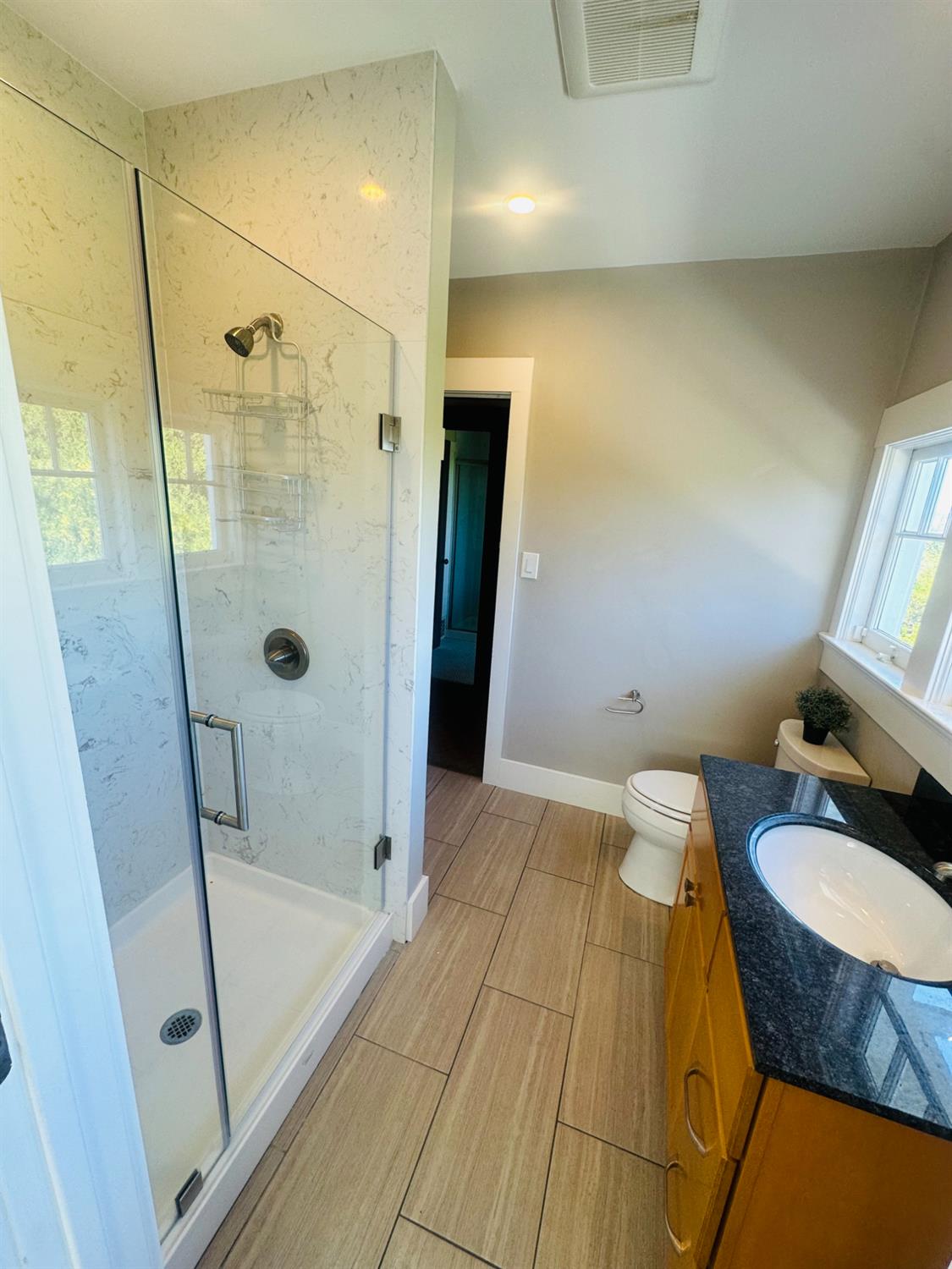 1556 E Street Hayward, CA 94541 - Photo 27 of 65 a bathroom with a sink and a mirror