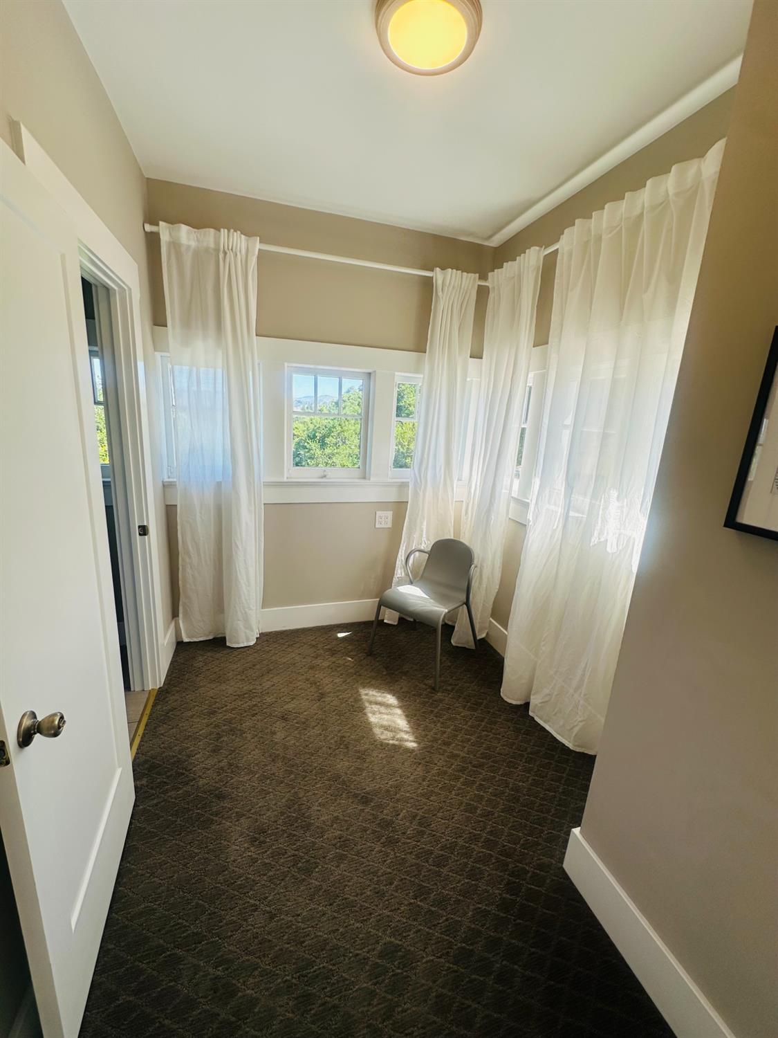 1556 E Street Hayward, CA 94541 - Photo 28 of 65 a view of an empty room with a window