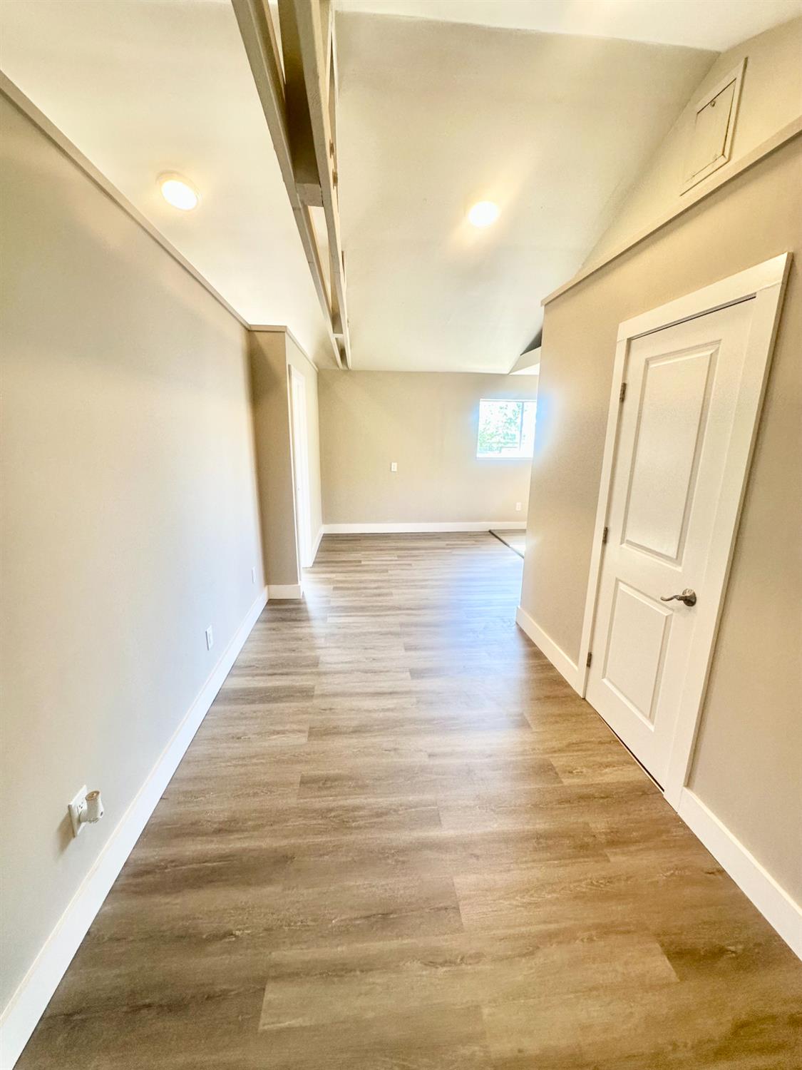 1556 E Street Hayward, CA 94541 - Photo 40 of 65 a view of a hallway with wooden floor