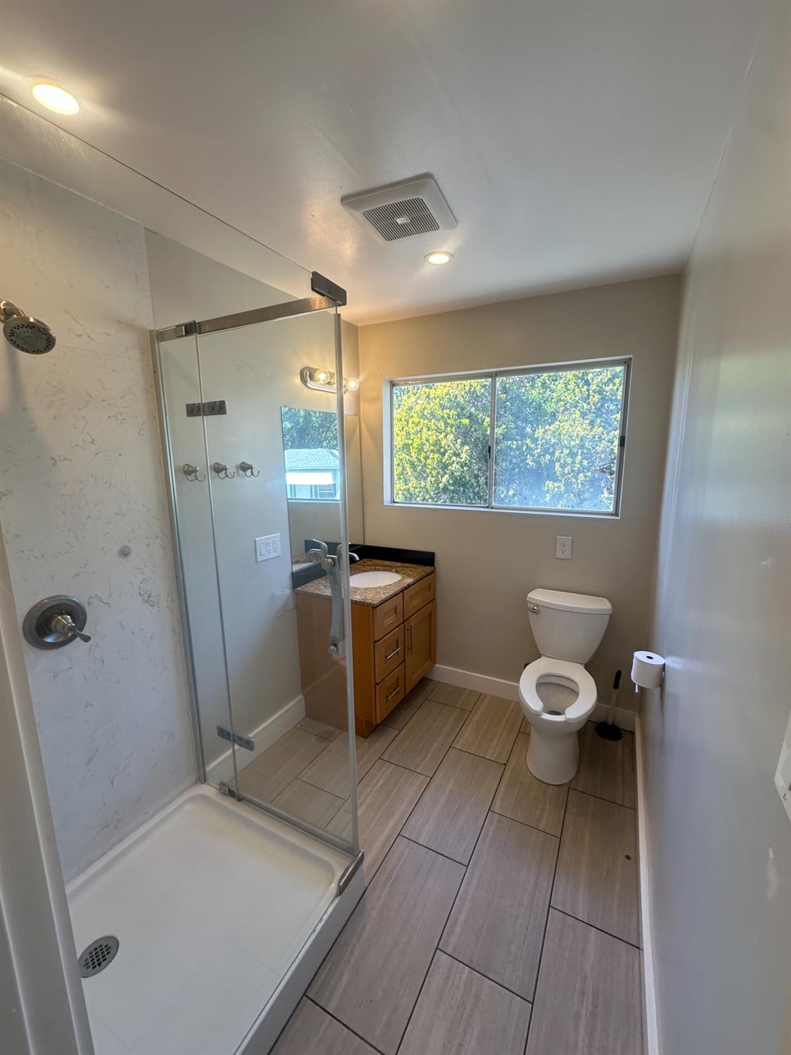 1556 E Street Hayward, CA 94541 - Photo 42 of 65 a bathroom with a sink toilet and shower