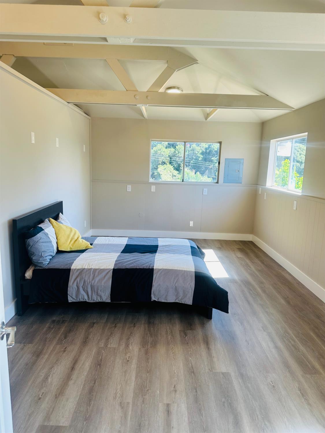 1556 E Street Hayward, CA 94541 - Photo 46 of 65 a living room with a couch wooden floor and a table