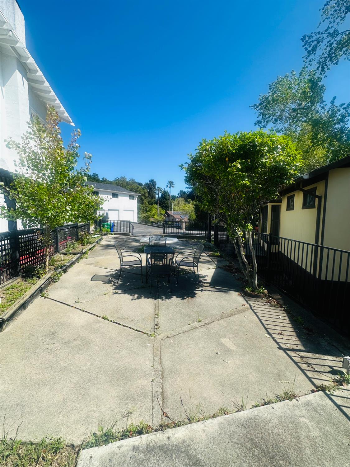 1556 E Street Hayward, CA 94541 - Photo 55 of 65 a backyard of a house with table and chairs