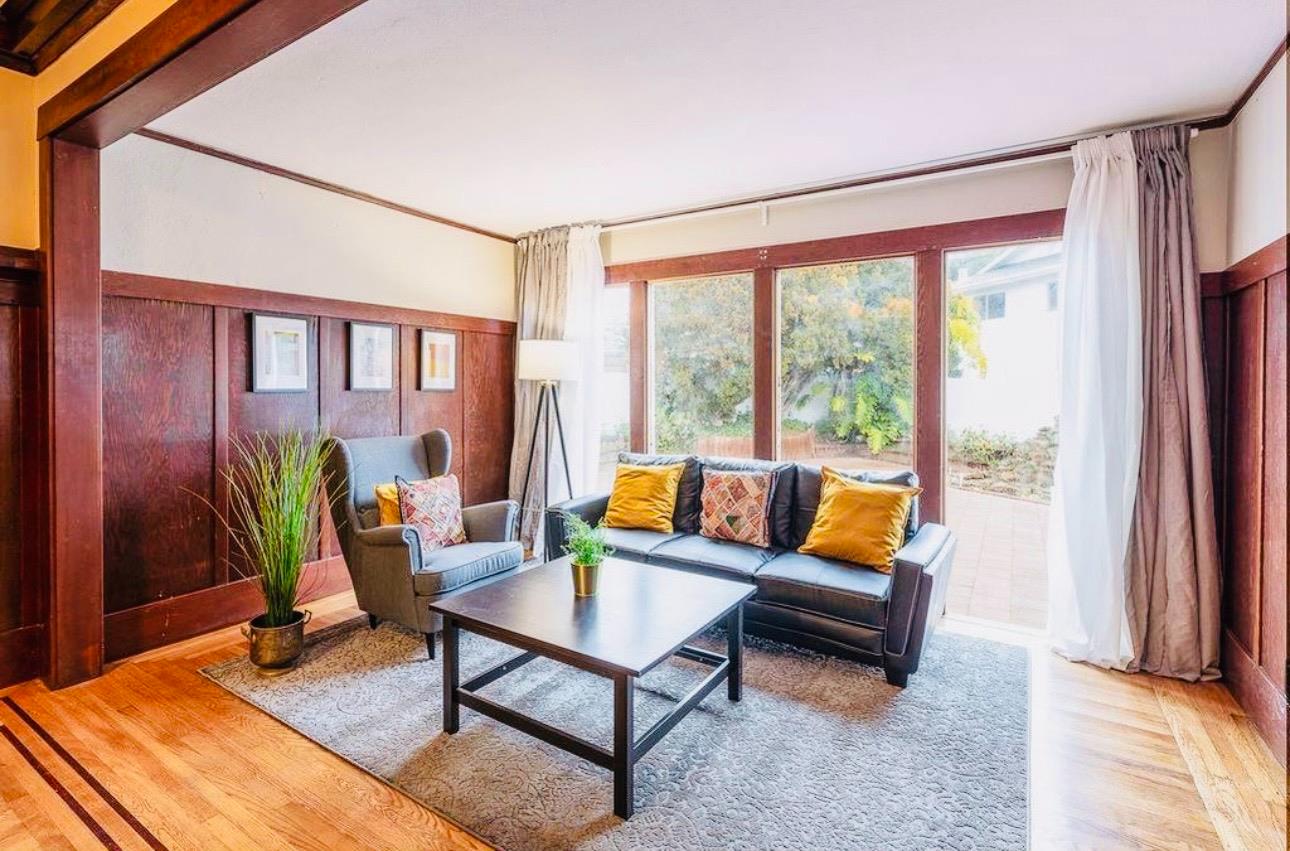1556 E Street Hayward, CA 94541 - Photo 9 of 65 a living room with furniture and a large window