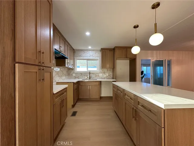 a large kitchen with a large island in it