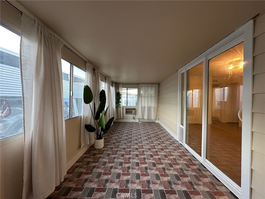 650-291 South Rancho Santa Fe Road San Marcos, CA 92078 - Photo 13 of 40 a view of a hallway with wooden floor