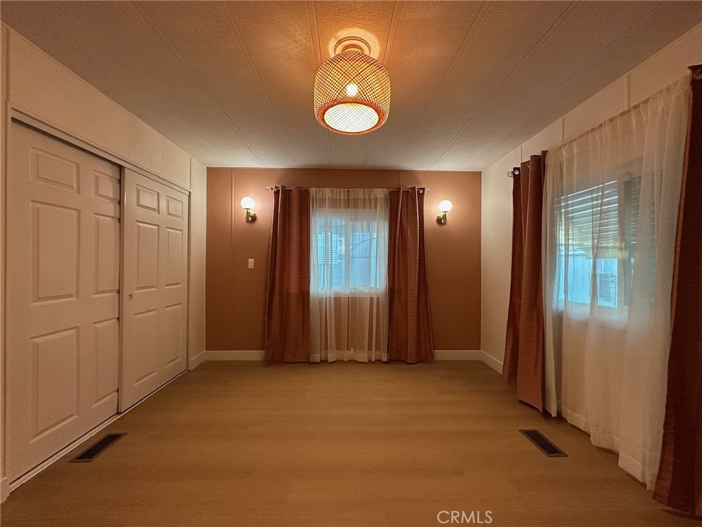 650-291 South Rancho Santa Fe Road San Marcos, CA 92078 - Photo 18 of 40 an empty room with closet and windows