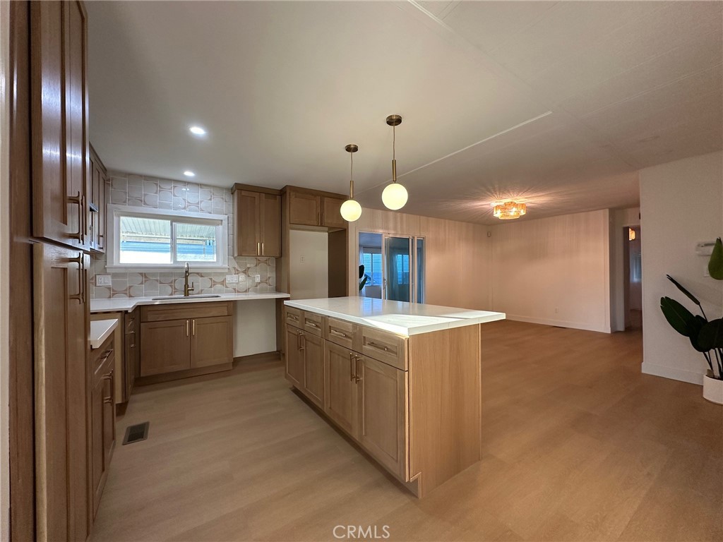 650-291 South Rancho Santa Fe Road San Marcos, CA 92078 - Photo 2 of 40 a kitchen with a stove a refrigerator and a microwave