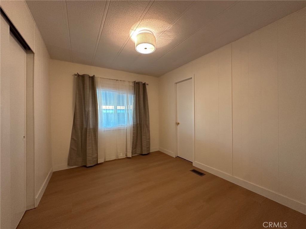 650-291 South Rancho Santa Fe Road San Marcos, CA 92078 - Photo 25 of 40 an empty room with windows and closet