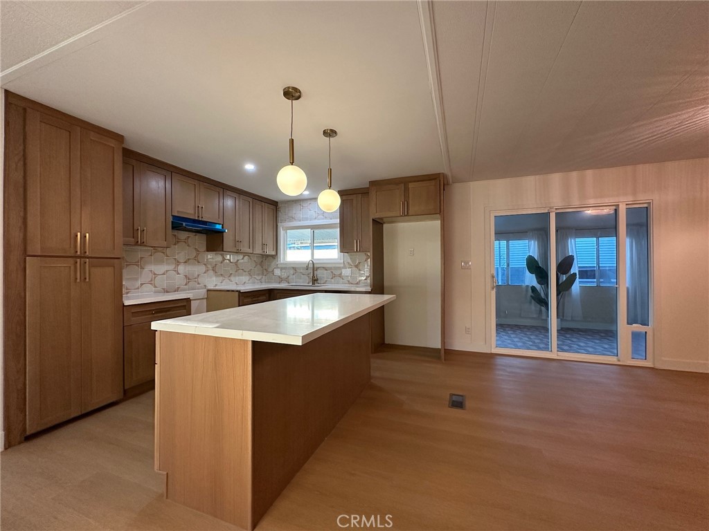 650-291 South Rancho Santa Fe Road San Marcos, CA 92078 - Photo 31 of 40 a kitchen with stainless steel appliances granite countertop a sink a stove and a refrigerator
