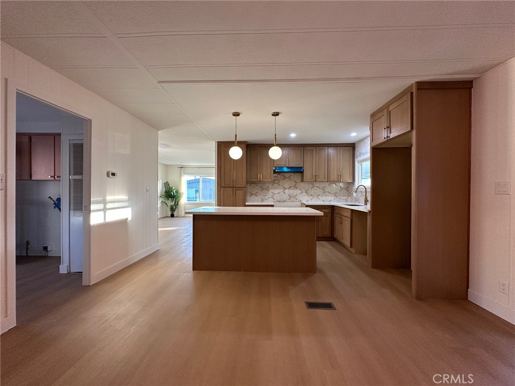 650-291 South Rancho Santa Fe Road San Marcos, CA 92078 - Photo 33 of 40 a large white kitchen with a refrigerator a sink and a cabinets