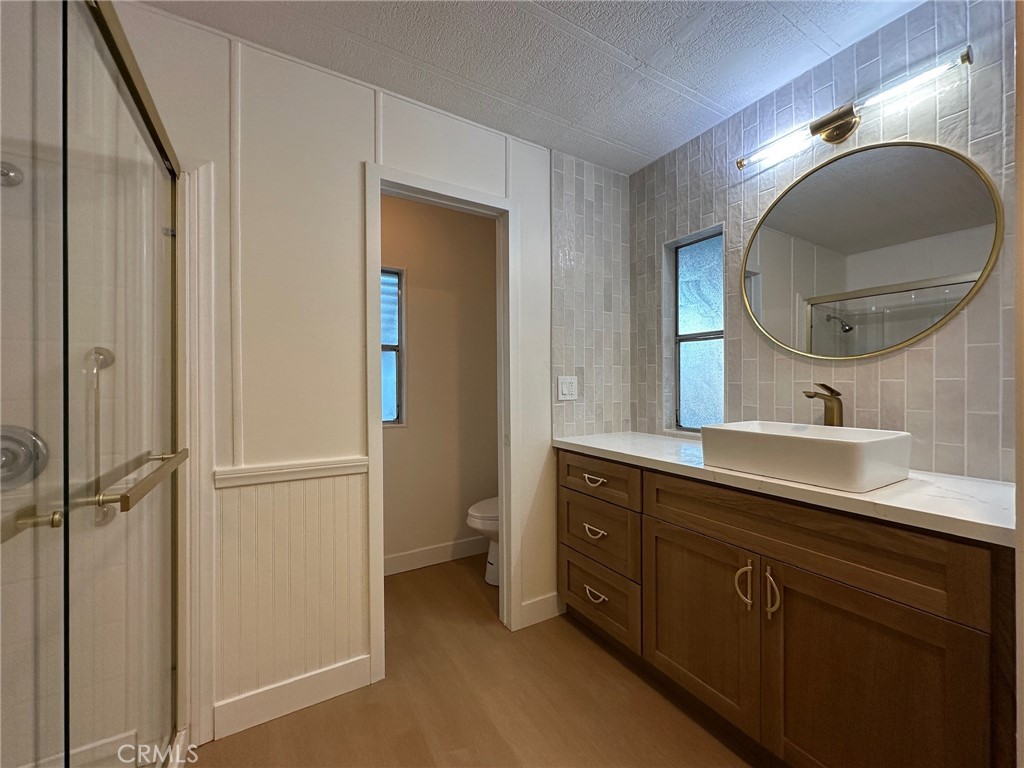 650-291 South Rancho Santa Fe Road San Marcos, CA 92078 - Photo 5 of 40 a bathroom with a double vanity sink and a mirror