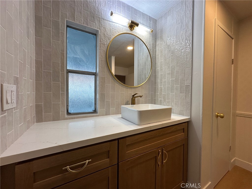 650-291 South Rancho Santa Fe Road San Marcos, CA 92078 - Photo 6 of 40 a bathroom with a sink and a mirror