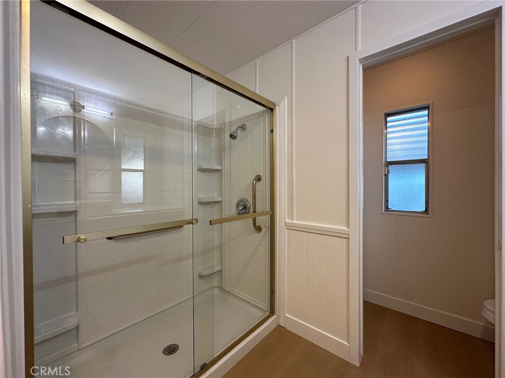 650-291 South Rancho Santa Fe Road San Marcos, CA 92078 - Photo 7 of 40 a bathroom with a glass shower door