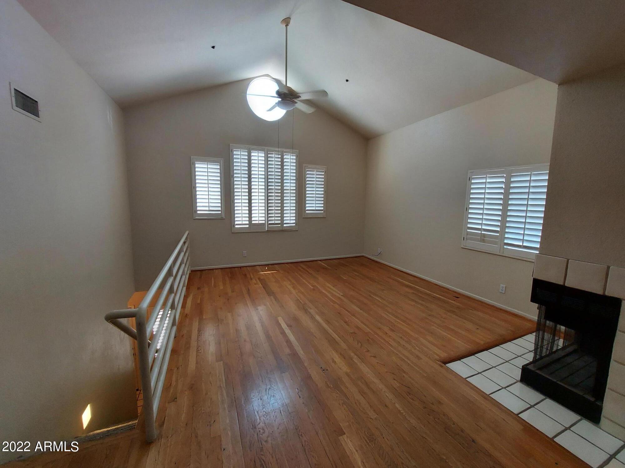 154 West 5th Street, Unit 246 Tempe, AZ 85281 - Photo 2 of 4 wooden floor in an empty room with a window