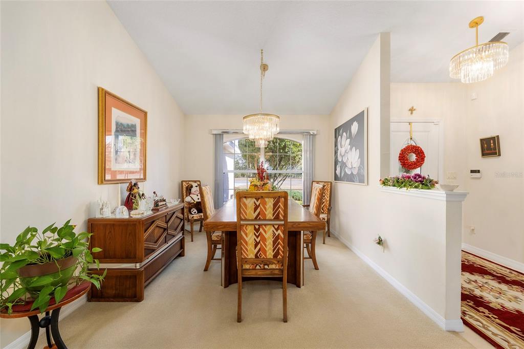 4670 Southwest 158th St Road Ocala, FL 34473 - Photo 15 of 42 a living room with furniture and a chandelier
