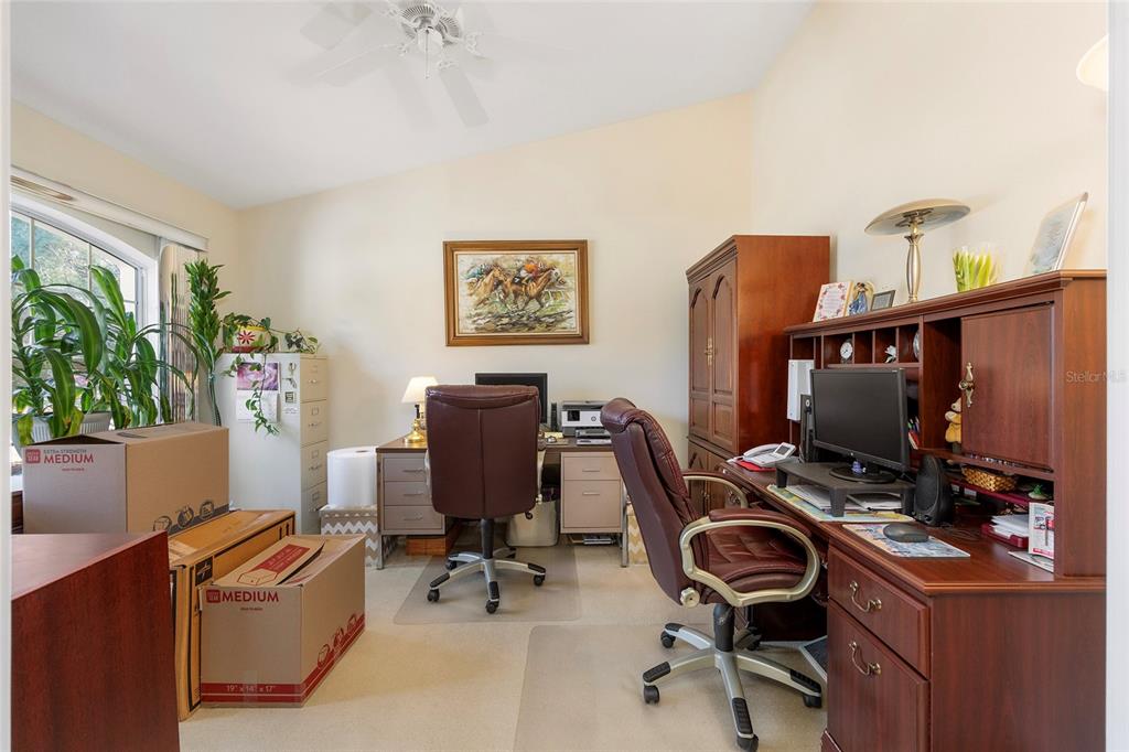 4670 Southwest 158th St Road Ocala, FL 34473 - Photo 18 of 42 a view of a workspace with furniture and a window
