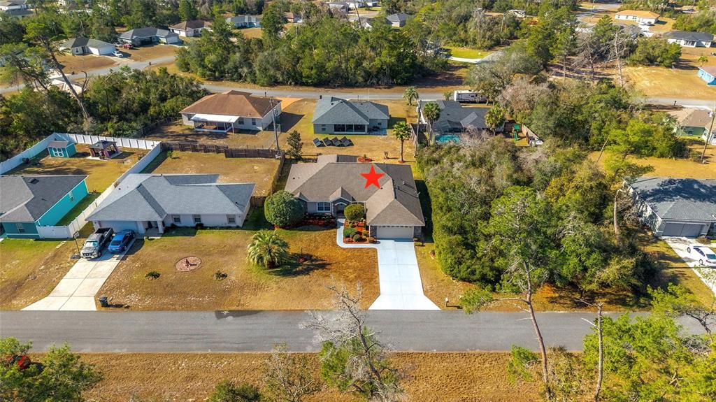 4670 Southwest 158th St Road Ocala, FL 34473 - Photo 36 of 42 an aerial view of a house with a swimming pool