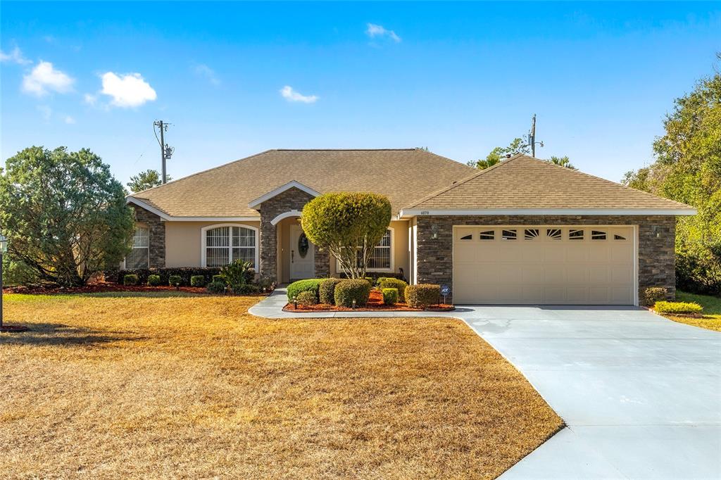 4670 Southwest 158th St Road Ocala, FL 34473 - Photo 42 of 42 a front view of a house with a yard and balcony