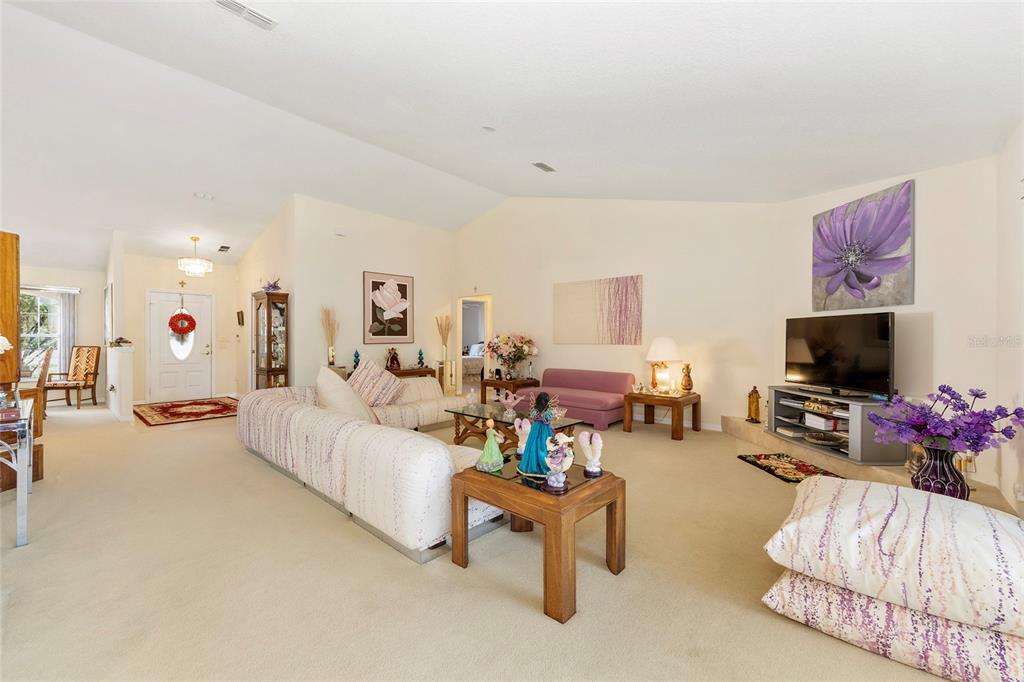 4670 Southwest 158th St Road Ocala, FL 34473 - Photo 7 of 42 a living room with furniture and a flat screen tv