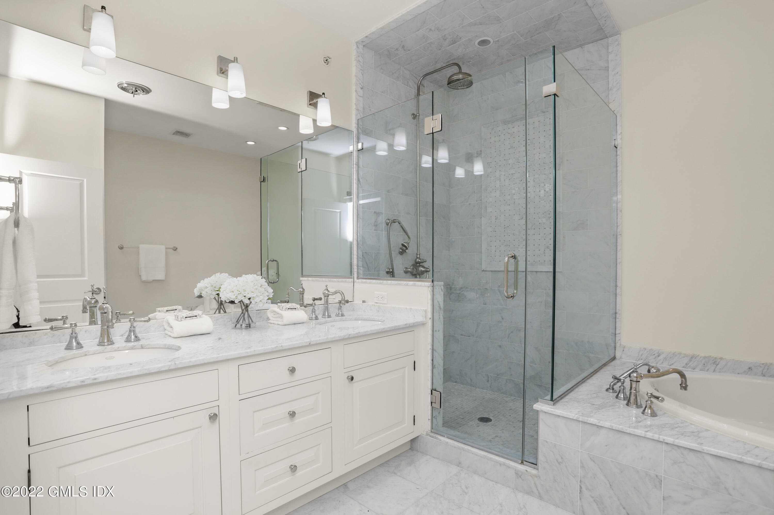 88 South Water Street, Unit 302 Greenwich, CT 06830 - Photo 11 of 21 a bathroom with a granite countertop sink mirror and shower