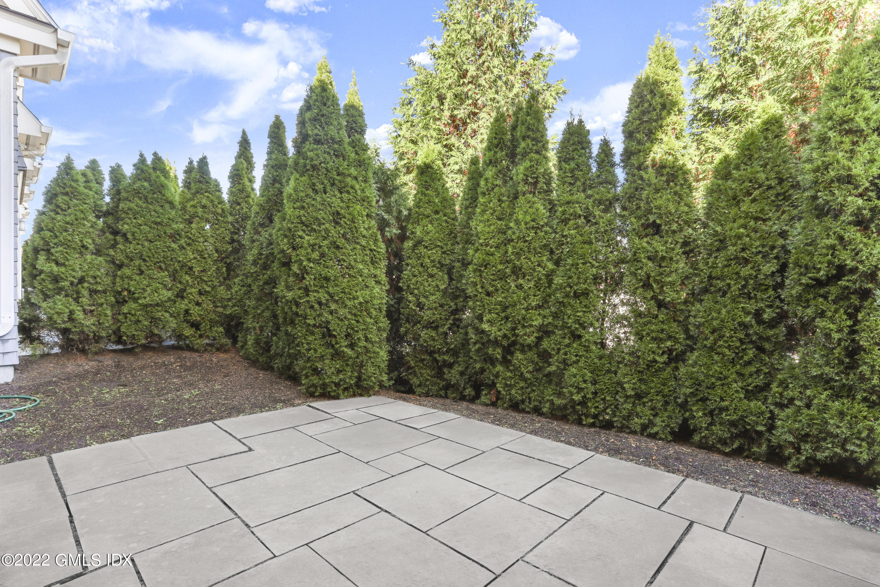 88 South Water Street, Unit 302 Greenwich, CT 06830 - Photo 14 of 21 a view of a yard with plants and a trees