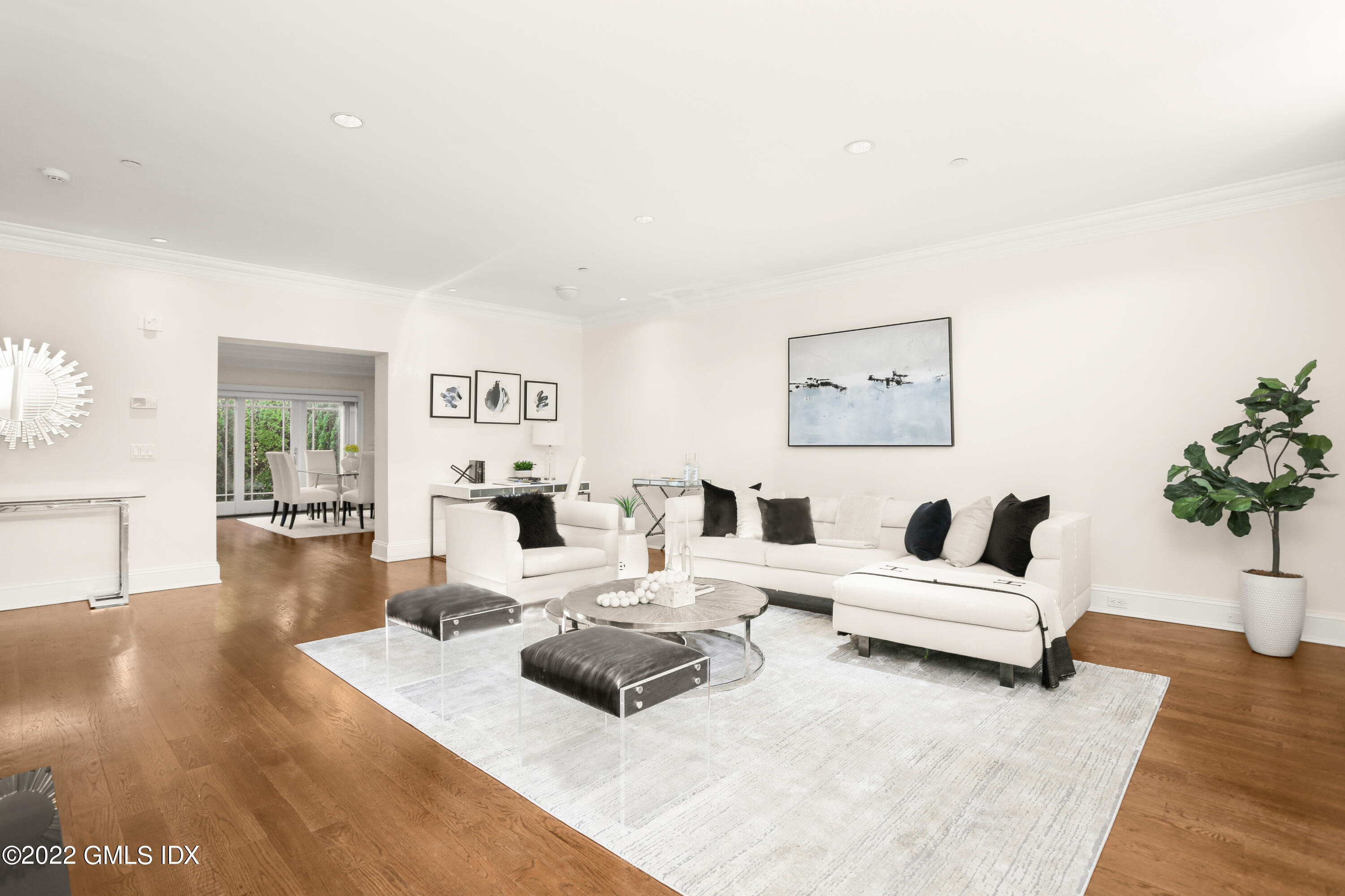 88 South Water Street, Unit 302 Greenwich, CT 06830 - Photo 3 of 21 a living room with furniture and wooden floor