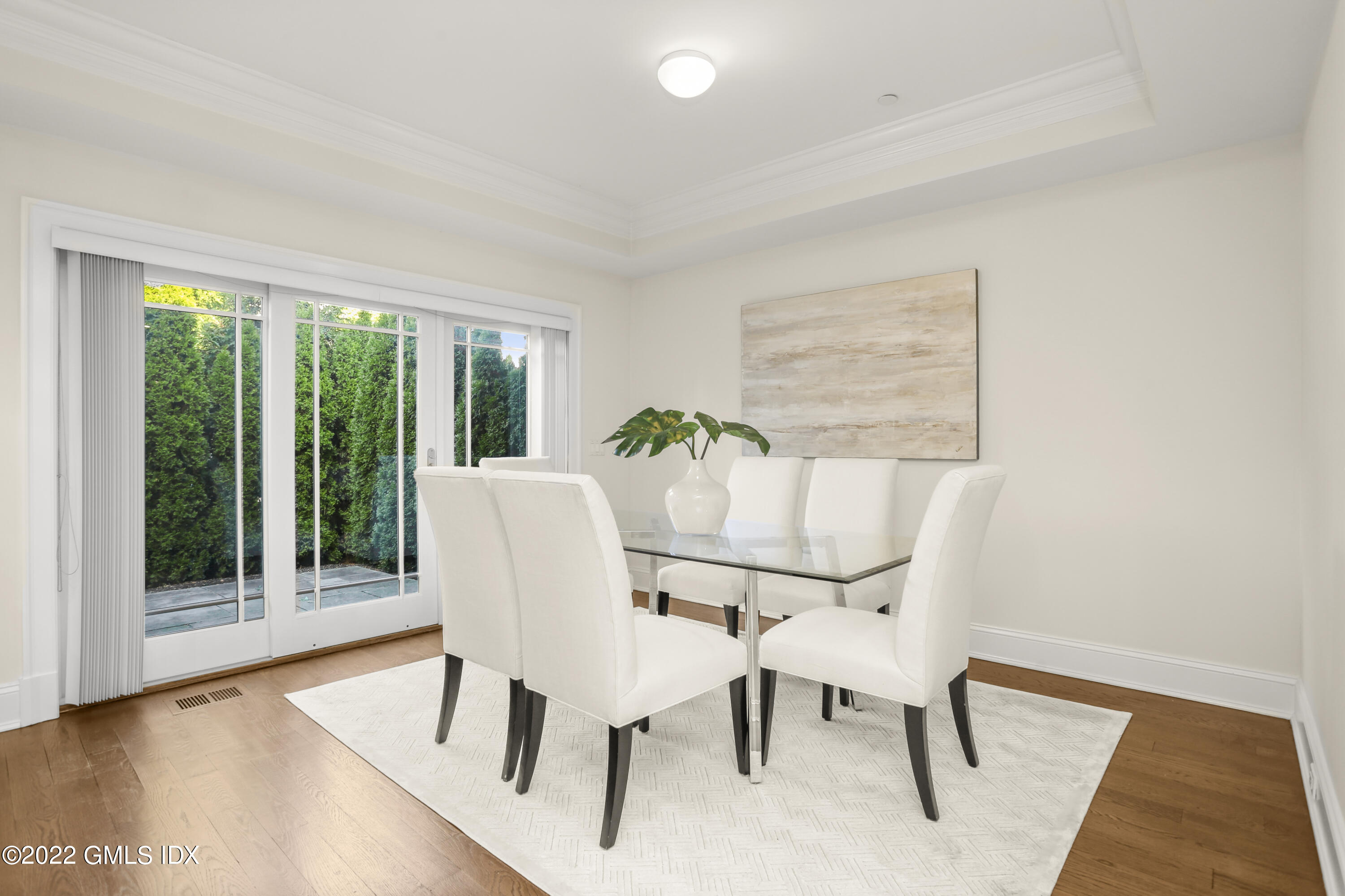 88 South Water Street, Unit 302 Greenwich, CT 06830 - Photo 6 of 21 a dining room with furniture and wooden floor