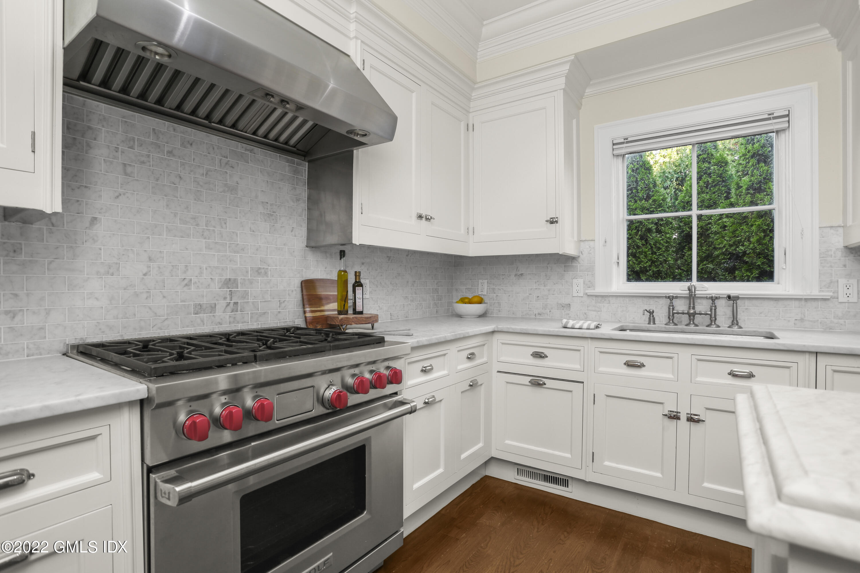 88 South Water Street, Unit 302 Greenwich, CT 06830 - Photo 7 of 21 a kitchen with a stove and white cabinets