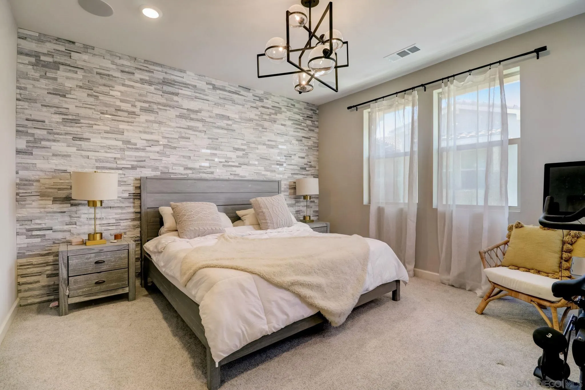 1206 Delpy View Point Vista, CA 92084 - Photo 13 of 29 a bedroom with a bed and a flat tv screen