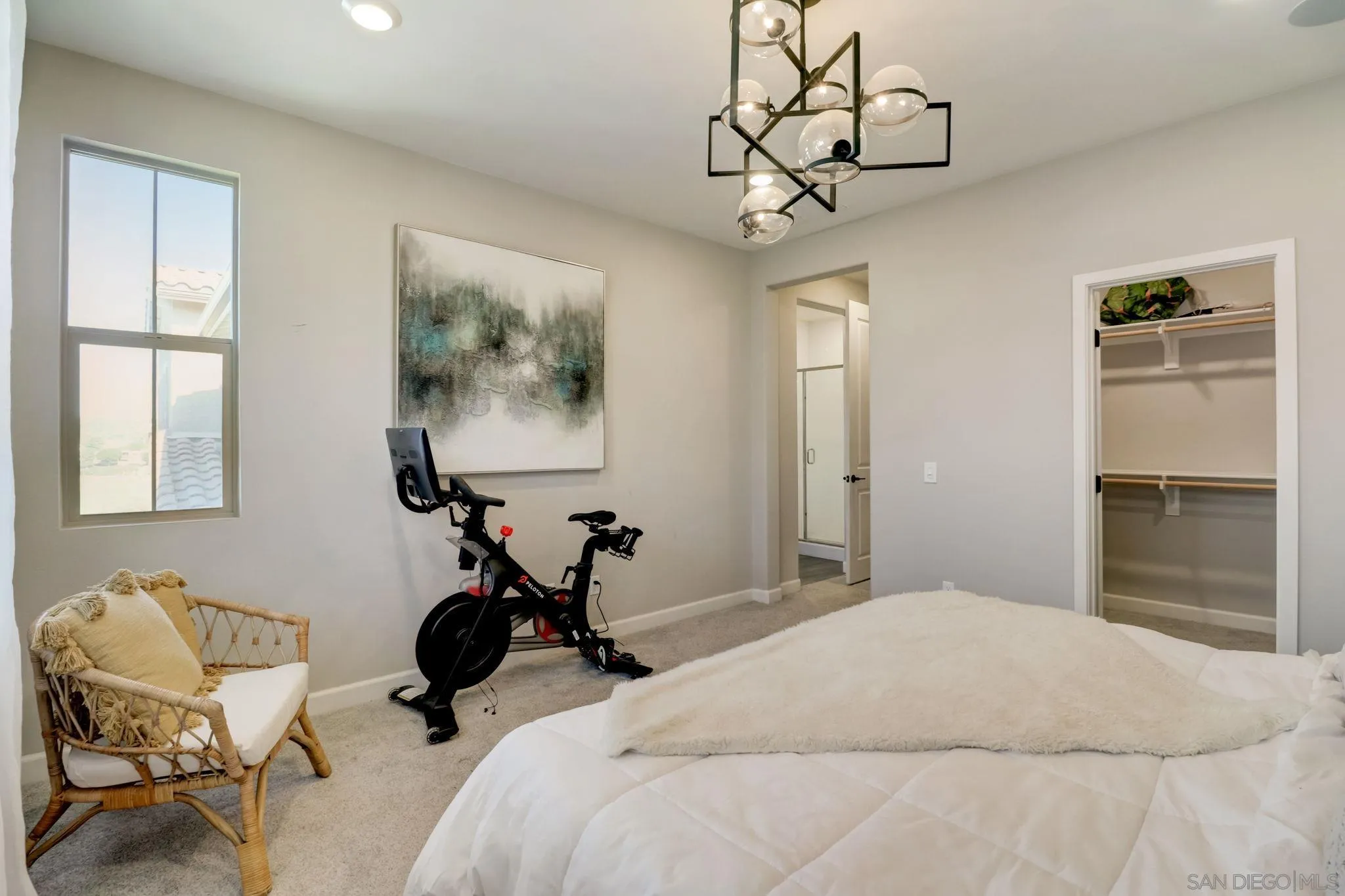 1206 Delpy View Point Vista, CA 92084 - Photo 14 of 29 a bedroom with a bed and a chandelier