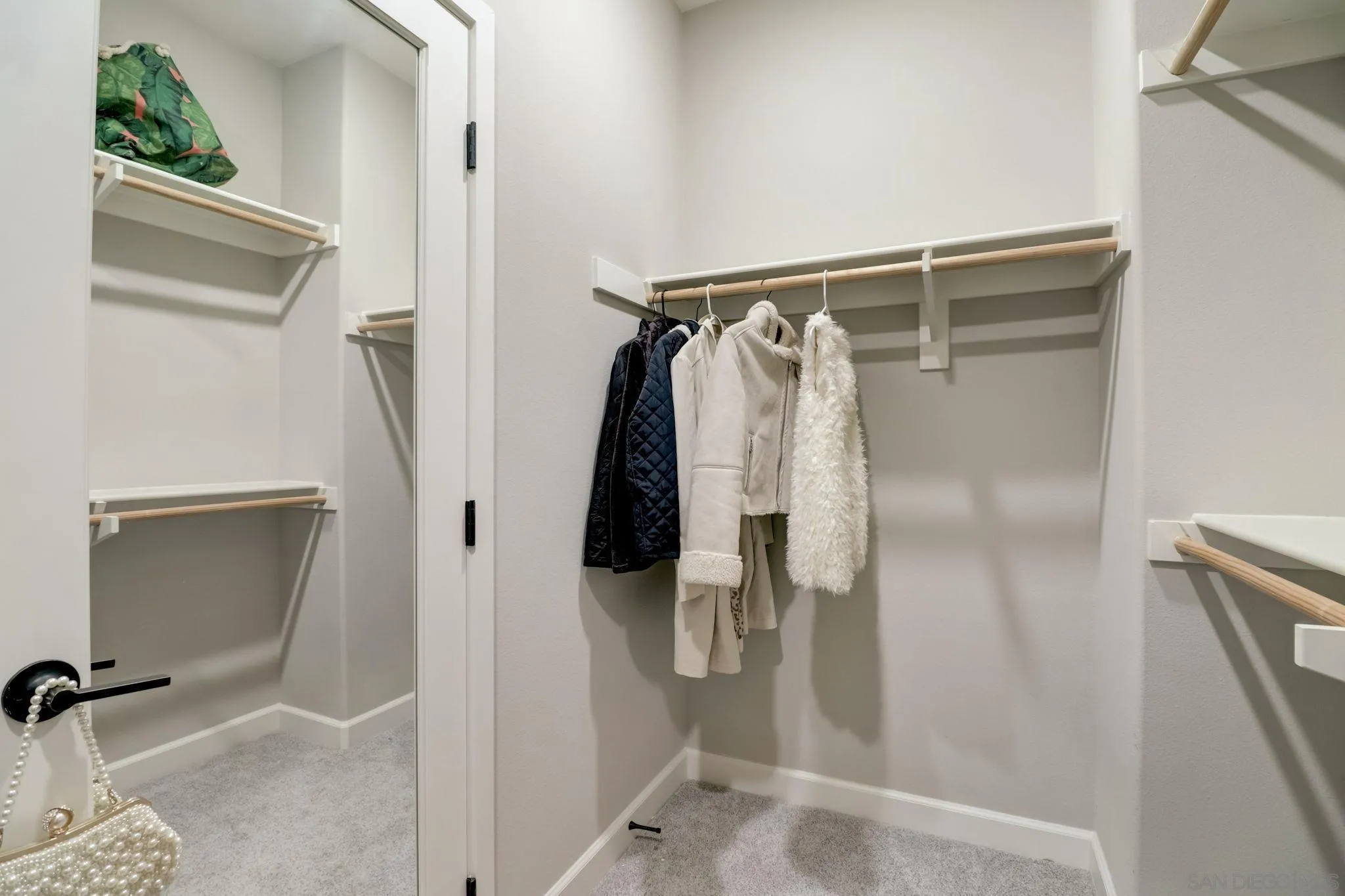 1206 Delpy View Point Vista, CA 92084 - Photo 15 of 29 a view of walk in closet with clothes and shoes