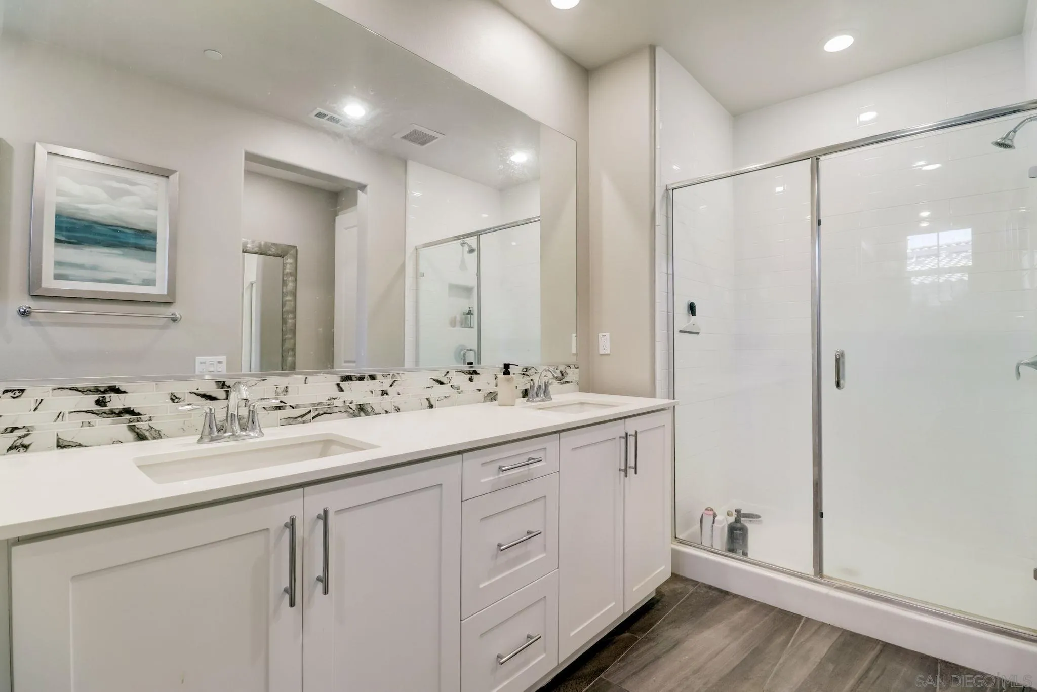 1206 Delpy View Point Vista, CA 92084 - Photo 17 of 29 a bathroom with a double vanity sink and mirror